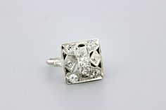 This fantastic ring is made in brilliant 14K white gold with dazzling pave set diamonds. This Mosaic square styled cocktail ring is set with 0.75ct total weight in white diamonds. The head of the ring is 16.22mm wide 16mm long and sits 6mm tall. The ring is a size 7.75 and can be resized upon request. B955FYSPD --Please reference our policy for more details-- For International orders, please provide a phone number for shipping purposes. Just place a note in the comment box during check out.Thank White Square-cut Diamond Ring, White Square Cut Diamond Ring, Dazzling Diamond White Ring With Square Cut, Dazzling Square-cut Diamond Ring With Accents, Square Cut Diamond White Ring, Dazzling Square Cut Diamond Ring With Accents, Dazzling White Square Cut Diamond Ring, Square Cut Platinum Diamond Ring With Accents, Diamond White Platinum Square Cut Diamond Ring