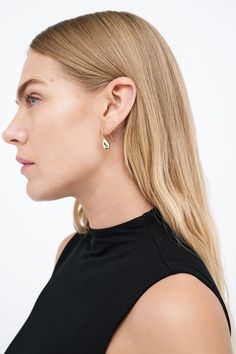 Modernism and minimalism collide in our Venus Drop Earrings. With a sleek profile and a reflective finish reminiscent of brilliant city lights, these sterling silver drop earrings are handcrafted to make your style shine day after day, night after night, season after season. Each pair includes a Marcella-branded vegan leather travel case for safe storage and easy travel.[SPLIT] Available in one size. Approximately .75” (2 cm) long. 18KT yellow gold plated brass. In silver, rhodium plated brass. Sleek Sterling Silver Jewelry For Formal Occasions, Modern Wrap Earrings For Everyday, Modern Pierced Hoop Earrings For Evening, Modern Teardrop Sterling Silver Wrap Earrings, Modern Sterling Silver Teardrop Wrap Earrings, Modern Sterling Silver Drop Earrings, Sleek Drop Earrings For Formal Occasions, Sleek Formal Drop Earrings Jewelry, Gift Polished Finish Linear Earrings