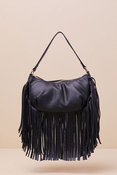 Spend Friday nights out on the town with the Bold Agenda Black Fringe Shoulder Bag! Pebbled faux leather shapes this elevated bag that features a crescent silhouette with a flat bottom design and a slender shoulder strap. Undo the top zipper to reveal a roomy, lined interior with a zippered sidewall pocket. Fun long fringe adorns the bottom of the bag for an eye-catching finish! Bag Measures 9. 5" Wide, 5. 25" Tall, And 3. 5" deep (Relaxed). 14" Shoulder Strap. Strap Has A 7. 25" DropLined. 100% UP. Imported. Lulus | Bold Agenda Black Fringe Shoulder Bag. Evening Faux Leather Hobo Bag With Removable Pouch, Trendy Hobo Bag With Removable Pouch For Party, Trendy Hobo Bag With Adjustable Strap For Party, Evening Hobo Shoulder Bag With Zipper, Chic Faux Leather Hobo Bag With Zipper Closure, Leather Hobo Bag For Fall Evening, Chic Fall Bags For Night Out, Evening Satchel Hobo Bag With Zipper Closure, Faux Leather Shoulder Bag With Zipper For Party