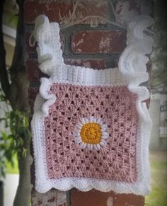 "This is a beautiful lady's, granny square crochet top. Made out of soft acrylic yarn, in  light rose with flower pattern and put together with a white color yarn. In three different sizes SMALL 25\" X 12\" MEDIUM 30\" X 15\" LARGE 34\" X 17\" Can machine wash, do not bleach.  Air dry or tumble dry on low (do not combine with other garments). This is made in a pet free, smoke free home. If you have any questions,  please feel free to contact me, LOVEN JUDY'S CREATIONS" White Crochet Top With Granny Square For Spring, White Granny Square Crochet Top For Spring, Handmade White Crochet Top For Spring, Cute Pink Crochet Top, White Hand Knitted Crochet Top For Spring, Fitted White Crochet Top With Granny Square Details, Fitted White Crochet Top With Granny Square, Handmade White Sleeveless Crochet Top, White Handmade Sleeveless Crochet Top