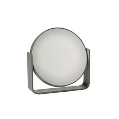 a white round light on a metal stand