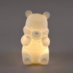 a light that looks like a teddy bear sitting on its hind legs, with eyes closed