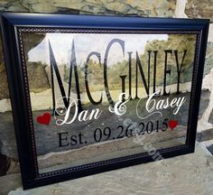 a framed sign that says, macginney dan & casey est 09 / 26 / 2015