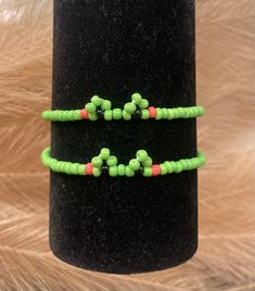 This frog themed bracelet is the cutest accessory to wear anywhere!🐸 Handcrafted by myself with quality seed beads and stretchy string made to fit all! Green Beaded Bracelet With Spacer Beads For Friendship, Playful Green Beaded Friendship Bracelets, Playful Green Beaded Bracelet As A Gift, Green Hand-strung Friendship Bracelets, Playful Green Beaded Bracelets, Casual Hand-strung Green Friendship Bracelets, Casual Green Hand-strung Friendship Bracelets, Casual Green Hand-strung Beads, Green Casual Beaded Bracelets With Spacer Beads