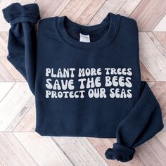 Plant More Trees, Save The Bees, Protect Our Seas - champion environmental consciousness with this trendy retro style sweatshirt! This planet-friendly pullover is perfect for Earth Day or as a gift for any environmentalist. These crewneck sweatshirts use the highest quality material for ultra-soft and comfortable wear, and they are great for staying snug on chilly days whether you are lounging at home or venturing out. Welcome to Atmos Design Collective! I love what I do and strive to make your shopping experience just right for you. If you have any questions or comments about my products, please feel free to send me a message anytime. Gildan 18000 Unisex Heavy Blend Crewneck Sweatshirt: - 50% cotton, 50% polyester - Classic fit - Ribbed knit collar with seam collar SIZING: Please refer to Environmental Activism, Earth Day Shirt, Environmental Consciousness, Retro Sweatshirts, Style Sweatshirt, Sweat Shirts, Save The Bees, Look Plus, Retro Stil