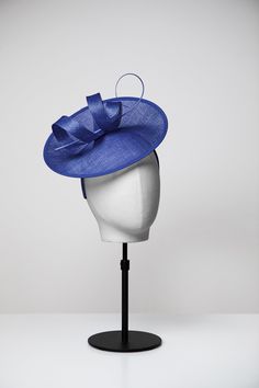 Our most popular style! Our Jenny Topper made with sinamay loops and a long curled ostrich quill feather, paired with the Medium Saucer base, measuring 26cm across. Secures to your head with a comfortable slim silk covered headband in the same colour.  Comes in our full range of 6 gorgeous colours: delicate Rose Pink, bright Fuchsia Pink, stunning Cobalt Blue, soft Navy, Black & Off-White. Each of our pieces separates into two and is connected by a small, but very strong, clip. This means to you Modern Hat, Hat Fascinator, Creating A Brand, Popular Style, Ladies Day, Mix Match, Fascinator, Pink Roses, Headpiece