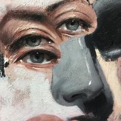 a close up of a person's face painted in black, white and grey