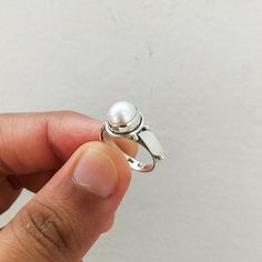 Important : PLEASE ENTER YOUR PHONE NUMBER IN THE "NOTE TO SELLER" SECTION DURING CHECKOUT, SO THAT THE DELIVERY CAN BE HASSLE FREE.Material: Solid Sterling silver Stone: pearl stone size: varies( According to the ring sizes)ships worldwide from India925 stampedHandmade itemOur products are totally handmade and made with high quality gemstones and 925 solid sterling silver.If you believe in buying top quality products for yourself and for your family and friends, SilverDynasty is the place where Silver Sterling Pearl Ring, White Gold Pearl Ring In Sterling Silver, Sterling Silver Open Pearl Ring With Polished Finish, Stackable White Gold Pearl Ring, Silver Pearl Promise Ring With Round Band, Sterling Silver Pearl Promise Ring, Sterling Silver Pearl Promise Ring With Round Band, Sterling Silver Pearl Ring For Anniversary, White Gold Sterling Silver Open Pearl Ring