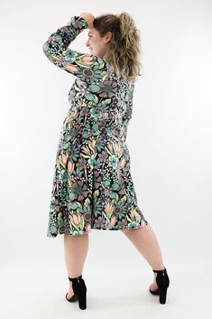 Flower Child Midi Dress with pockets features pastel coloured flowers in green, orange and yellow, printed across a black background. Finished with a stunning full length bell sleeve, invisible pockets, subtle empire waist and a v-neck line. NEW SIZING Range: Midi Length DressStyle: Full Length Bell Sleeve - V-neck - A-line dress Size Recommendation: If in between sizes, size down for a firmer fit, size up for a looser fit. Made with curves in mind Sizes 6-28 Two side pockets V-neckline Suitable