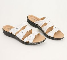 Easy to slide on and off, these leather sandals are summer's best friend. From Clarks Footwear. Leather Slide Clogs For Summer, Summer Leather Footbed Slip-on Slides, Comfortable Round Toe Footbed Sandals For Summer Outings, Comfortable Footbed Sandals With Round Toe For Summer Outings, Summer Beach Clogs With Leather Footbed, White Leather Footbed Flip Flops For Summer, Summer Slide Clogs With Cushioned Footbed, White Leather Flip Flops For Summer, Comfortable Open Toe Clogs For Vacation