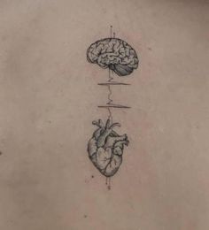 the back of a woman's stomach with two hearts and a brain on it