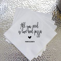 three personalized napkins that say all you need is love and pizza