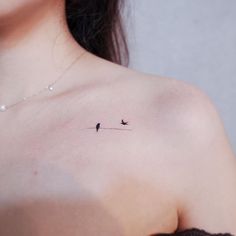 a woman with a small tattoo on her chest