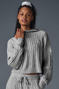 Perfect your cozy vibe in the Winter Bliss Hoodie. Designed with a chunky cable-knit and a next-level-soft, almost fuzzy feel, this closet staple has a relaxed fit with a slightly cropped hem and slits at the sides. Pair it with your favorite leggings, trousers, or—better yet—the matching Winter Bliss Pants. Cozy Alo Yoga Loungewear Outerwear, Alo Yoga Winter Outerwear With Ribbed Cuffs, Alo Yoga Sweater For Fall Loungewear, Alo Yoga Fall Sweater For Loungewear, Alo Yoga Winter Loungewear Outerwear, Sporty Alo Yoga Outerwear For Loungewear, Alo Yoga Long Sleeve Fall Sweater, Cozy Cable Knit Sweater For Cold Weather, Alo Yoga Sweater For Winter Loungewear