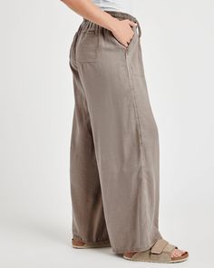 The comfort and ease of our Paula Wide Leg Pant will leave you reaching for it all season long. Made from a breathable linen blend, it's designed with a drawstring, roomy front and back pockets and the most relaxed wide leg ever. Elevate it with a sweater or a layering tee. Linen blend Drawstring waist Front and back pockets Ultra wide leg Flax Wide-leg Pants With Pockets, Summer Pants With Drawstring For Everyday Wear, Linen Wide-leg Bottoms With Side Pockets, Comfortable Straight Leg Bottoms With Drawstring, Relaxed Everyday Bottoms With Side Pockets, Comfortable Linen Wide Leg Pants For Spring, Linen Drawstring Relaxed Fit Pants, Spring Linen Pants With Drawstring, Linen Drawstring Pants With Relaxed Fit