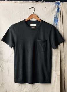 Black Crew Neck T-shirt With Side Pockets, Washed Black Short Sleeve Tops With Pockets, Black Short Sleeve T-shirt With Side Pockets, Unstructured Black Tops With Pockets, Washed Black Cotton Tops With Pockets, Washed Black Cotton Top With Pockets, Black Top With Side Pockets For Summer, Black Summer Tops With Side Pockets, Black Crew Neck Top With Side Pockets