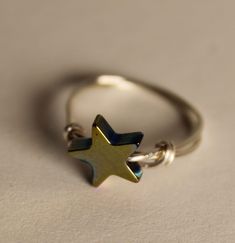 "This cute ring is super popular!  I have sold more star rings than I can count!  It's a great gift!  It's a fave of girls, women, and all ages between!   Hematite is known for its grounding properties. *healing crystal ring *genuine hematite star is 1/2\"   *wire band *minimalist design *different sizes *electroplated star Message me for size, metal, star option availability  Custom order requests and prices vary" Wire Wrapped Star, Hematite Ring, Ring Crystal, Jewelry Minimalist, Healing Crystal Jewelry, Diy Wire Jewelry, Wrap Ring, Wire Wrapped Rings, Star Ring