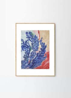 a blue and red painting hanging on a wall