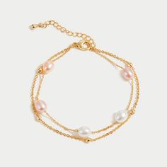 Discover the stunning beauty of real freshwater pearls with this layered bracelet. With beautiful shades of ivory and delicate pink, this bracelet will definitely elevate any outfit. 18K gold plated Freshwater pearl Length: 6.1in (+ 1.8in adjustable) Lobster clasp closure Hypoallergenic, lead & nickel free If you a Celine Pearl, Layered Bracelet, Bubble Bag, Black Gift Boxes, Halloween Sale, Layered Bracelets, High Quality Jewelry, Ladies Day, Earring Necklace