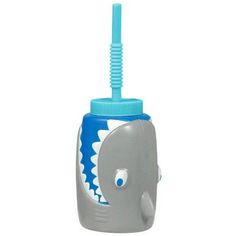 a toothbrush holder with an elephant design on the front and blue top, attached to a plastic tube