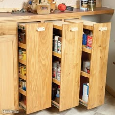 a wooden cabinet filled with lots of food and condiments on top of it