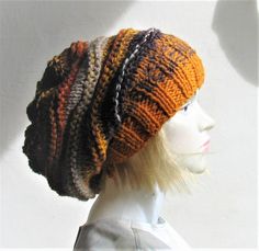 a mannequin head wearing a knitted hat