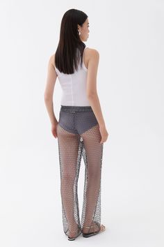 These high waisted mesh pants with an elastic waistband and glitter thread offer a fashionable and flattering design, perfect for enduring your busy lifestyle from day to dinner. Dry clean Material: 100% Polyester High rise Officially licensed Imported Brand: Nocturne Model Product Size: S Model Size: Height 5'10 / Bust 29.5 in / Waist 23 in / Hips 34 in True the size Sheer Mesh Stretch Bottoms, Sheer Stretch Mesh Bottoms, Fitted Mesh Bottoms With High-cut Leg, Chic Mesh Bottoms For Summer, Fitted High Waist Mesh Pants, High Waist Fitted Mesh Pants, Stretch Fishnet Bottoms For Spring, Chic Sheer Mesh Bottoms, High Waist Mesh Stretch Bottoms