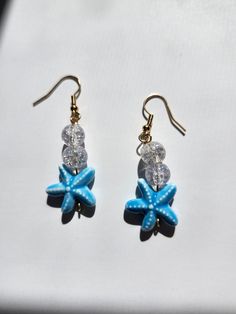 These pretty and blue starfish earrings would go perfect with any beach look or down the shore vacation. Ocean-inspired Blue Jewelry With Star Charm, Blue Star Jewelry For Vacation, Blue Star Shaped Jewelry For Vacation, Blue Star Charm Earrings As Gift, Blue Star Charm Earrings For Gift, Summer Vacation Earrings With Ear Wire, Summer Vacation Ear Wire Earrings, Ocean-inspired Jewelry For Beach Party, Ocean-inspired Jewelry For Beach Vacation