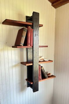 the bookshelf is made out of wood and has three shelves