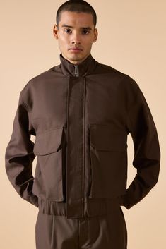 Keep out the chill while looking slick in a boohooMAN coat. Rev up your outerwear inventory this season with our unrivalled collection of coats and jackets for men. Whether you're looking for a heavy coat to combat the low temperatures, or a lightweight jacket to stand out while having fun at your favourite festival, we've got the trendiest designs to finish off your outfit with. Puffers, parkas and borg jackets are the perfect choices if you want to bundle up without sacrificing on style, and Urban Outerwear With Stand Collar And Ribbed Cuffs, Urban Outerwear With Ribbed Cuffs And Stand Collar, Winter Outerwear With Stand Collar For Streetwear, Winter Streetwear Outerwear With Stand Collar, Urban Cotton Outerwear For Cold Weather, Fall Techwear Track Jacket With Stand Collar, Fall Techwear Windbreaker With Stand Collar, Urban Cotton Outerwear For Winter, Urban Style Parka For Streetwear In Fall