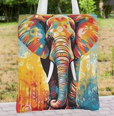 A stunning Elephant graphic tote bag with an all over design. Can be used in so many different ways; the beach, the shops, out with friends. The attractive design is sure to be talking point with your friends. An ideal gift at any time of the year. Choose from 4 designs. Available in 3 sizes to add both functionality and style, made with spun polyester, these bags feature double-stitched seams, cotton webbing straps, and nonwoven laminate lining for high-end durability.  .: Made with 100% polyes Multicolor Travel Bag With Graphic Print, Artistic White Bag For Summer, Large Multicolor Bag For Gifts, Graphic Print Tote Shoulder Bag As Gift, Large Multicolor Bag Perfect For Gifts, Multicolor Bags With Graphic Print For Shopping, Multicolor Shopping Bags With Graphic Print, Multicolor Tote Beach Bag As Gift, Multicolor Canvas Bag For Summer Gift