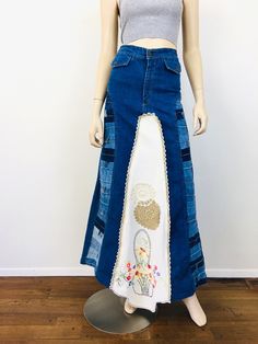 Vintage 1970s Patchwork Denim Maxi Skirt - high waisted - pockets with button closures - made from from french dip bell bottom jeans w/ patchwork waistbands - embroidered tablecloth with floral design, front & back - crochet trim - zipper fly Great vintage condition appx size - S 26 waist 36 hip 42.5 length / little longer at front All sales are final / as-is. We do not accept returns. Vintage Fitted Bottoms For Festival, Vintage Patchwork Bottoms, Vintage Medium Wash Bottoms For Festival, Vintage Festival Bottoms With Pockets, Vintage Fitted Skirt In Medium Wash, Vintage Cotton Bottoms For Festival, Vintage Fitted Medium Wash Skirt, Vintage Fitted Denim Skirt For Spring, Retro Fitted Denim Skirt With Pockets