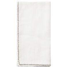 a white napkin with rope trimmings on it