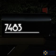 a black mailbox with the number seventy8 written on it