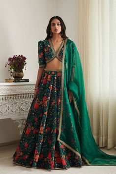 Emerald green floral print lehenga with hand embellished golden cord and multicoloured thread and sequin details. Comes with a padded blouse and organza dupatta.
Components: 3
Pattern: Embroidered
Type Of Work: Sequin, Thread
Neckline: V Neck
Sleeve Type: Puffed
Fabric: Chanderi, Chiffon
Color: Green
Other Details: 
Back tie-up blouse
Note: Potli bag shown in the image is not for sale
Occasion: Mehendi and Haldi - Aza Fashions Chinon Fabric Lehenga, Different Types Of Lehenga Pattern, Unstitched Green Organza Lehenga, Green Bollywood Lehenga With Floral Embroidery, Bollywood Style Green Lehenga With Floral Embroidery, Festive Green Embroidered Fabric With Sheer Dupatta, Designer Green Lehenga With Floral Embroidery, Unstitched Green Organza Choli, Green Embroidered Organza Choli