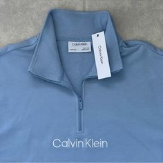 Calvin Klein Men Relaxed Fit French Terry Quarter-Zip Logo Sweatshirt Color: Light Blue Size: Xxl Brand New Retail Price $98.00 A Quarter-Zip Closure Freshens This Classic Layering Look From Calvin Klein, A Soft Relaxed Fit Sweatshirt In French Terry With Signature Flair. Material: 88% Cotton 12% Polyester Imported Zipper Closure Machine Washable Relaxed Fit Long Sleeve Sweatshirt Stand Collar And Quarter Zip French Terry Fabric Ribbed Knit Trim Embroidered Calvin Klein Logo At Chest And On Side Calvin Klein Blue Cotton Tops, Blue Calvin Klein Cotton Tops, Calvin Klein Sporty Long Sleeve Tops, Blue Cotton Half-zip Sweatshirt, Calvin Klein Hoodie, Brown Sweatshirt, Black Crewneck Sweatshirt, Henley Shirt Men, French Terry Hoodie