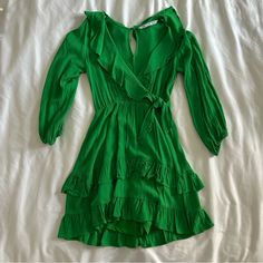 Size Xs Never Worn Shorts Underneath Green V-neck Ruffle Dress For Brunch, Green Mini Ruffle Dress For Summer, Chic Green Mini Dress With Ruffles, Green Mini Dress With Ruffled Skirt For Spring, Spring Green Mini Dress With Ruffled Skirt, Green Ruffled Mini Dress For Spring, Flirty Green Mini Dress With Ruffles, Summer Long Sleeve Dress With Ruffled Skirt, Long Sleeve Dress With Ruffled Skirt For Summer