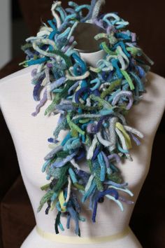 "The Ocean Blue Boa scarf is perfect for those who enjoy the practical as well as the whimsical.  It's practical in that it will keep you oh-so-warm-and-toasty.  The multi-directional strips of wool made from the seams of felted sweaters reach out in every direction to trap warm air and hold it close to your body, insulating you from the cold temps.  It's whimsical because...it's a boa, and let's face it, who doesn't feel glamorous in a boa?  Practicality + Whimsy = the warmest and most unique s Handmade Wool Scarf, Hand Dyed Scarves, Turquoise Scarf, Recycled Sweaters, Recycled Sweater, Merino Wool Scarf, Ribbon Yarn, Upcycle Sweater, Felted Scarves