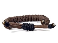 This slim brown bracelet is a perfect complement to any style. Adjustable and fits on most wrists. 100% paracord. Handmade as soon as you order it. Feel free to ask any questions. Usually ships within 1-2 business days. Brown Bracelet, Paracord, Rope Bracelet, Wrap Bracelet, Ships, Feel Free, Bracelet