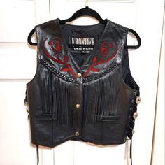 Genuine Leather Ladies Motorcycle Vest With Fringe Design And Red Rose Cut Out. New Without Tags. Has Extra Snaps. Size Medium. Approximate Measures Are From Back Shoulder To Shoulder 14 Inches. Front Length 19 And 1/2 Inches. From Armpit To Armpit In The Front Measurement Is Approximately 19 In.. Depending How You Like Your Fit, It Can Fit Up To 39" Breast Measurement. I Am 36 And It Fits Nice Too Black Fitted Western Outerwear, Fitted Black Western Outerwear, Ladies Motorcycle, Leather Vests, Brown Puffer, Black Leather Vest, Motorcycle Vest, Pink Vest, Womens Puffer Vest