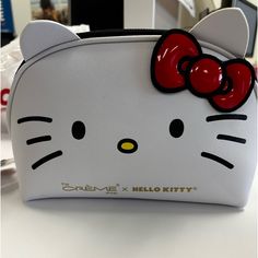 a hello kitty purse sitting on top of a table