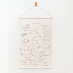 a dinosaur poster hanging on a wall