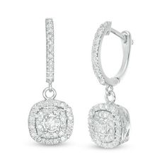 Complement her romantic look with these sparkling diamond drop hoop earrings. Crafted in 14K white gold, each earring dangle features a 1/8 ct. diamond wrapped in a round and cushion-shaped diamond frame. The ear wires also shimmer with diamonds. Radiant with 7/8 ct. t.w. of diamonds and a bright polished shine, these hoops secure with hinged backs. Fine Jewelry Dangle Hoop Earrings With Halo Design, Fine Jewelry Diamond Dangle Earrings With Halo Setting, Anniversary Dangle Hoop Earrings With Diamond Accents, Anniversary Diamond Dangle Earrings With Accents, Diamond Dangle Hoop Earrings Fine Jewelry, Dangle Diamond Hoop Earrings Fine Jewelry, Diamond Cut Dangle Hoop Earrings, Diamond-cut Dangle Hoop Earrings, Diamond-cut Dangle Hoop Earrings In Diamond