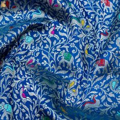 blue and white fabric with colorful designs on it