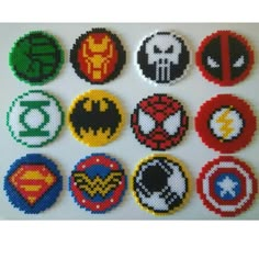 the avengers and superman logos are made out of perler beads, which have been sewn together