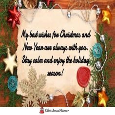 a christmas message with ornaments around it and a wooden board in the middle that says, my best wishes for christmas and new year are always with you stay calm