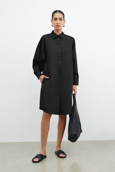 FINAL SALE - NO RETURNS, EXCHANGES, OR STORE CREDITIf only everything in life was as effortless as our Raphaela Shirt Dress. Refined and relaxed, she's cut from 100% soft, breathable European cotton in an oversized fit and detailed with a crisp collar and mother-of-pearl buttons. Raphaela is then finished with one geometric front pocket for a touch of unique edge so you can look perfectly composed in her from AM to PM. | Astrid, in sage and in black, is 5'9" (175 cm) tall, wearing size XS. Nane, Black Shirt Dress Outfit, Oversized Dress Shirt, Poplin Shirt Dress, Am To Pm, Shirt Dress Outfit, Oversized Shirt Dress, Her Cut, Minimalist Dresses, Cotton Shirt Dress