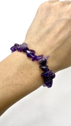 Amethyst Chips Bracelet You will receive 1 (ONE) Amethyst Chips Bracelet similar to the item in the picture Great for mixing and matching with other regular bracelets. . Amethyst has healing powers to help with physical ailments, emotional issues, and in Energy Healing and Chakra balancing. Amethyst crystal therapies are primarily associated with physical ailments of the nervous system, the curing of nightmares and insomnia, and balancing the crown chakra. FOLLOW US ON INSTAGRAM @earthsmineralsi Purple Crystal Bracelet For Gift, Amethyst Beaded Bracelet For Healing, Amethyst Gemstone Crystal Bracelet, Adjustable Purple Crystal Bracelet With Stones, Purple Spiritual Crystal Bracelet With Stones, Spiritual Purple Beaded Bracelets With Stones, Adjustable Purple Crystal Bracelet, Spiritual Purple Crystal Bracelet With Stones, Purple Amethyst Crystal Bracelet With Gemstone Beads