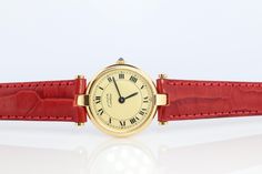 Genuine Cartier watch. Vintage Must de Cartier Vendome Rare Cream dial. Sapphire Cabochon Crown. Condition: Comes with Cartier case. Wear consistent with age. New genuine leather red band. New battery installed. Details: 24mm Round case Sapphire Cabochon, Cartier Watch, Watch Vintage, Red Band, White Face, Women Wrist Watch, Wrist Watches, Cartier, Jewellery And Watches