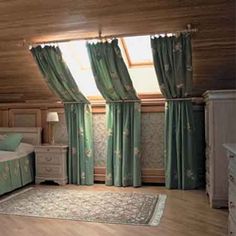 there is a bed in the room with green curtains